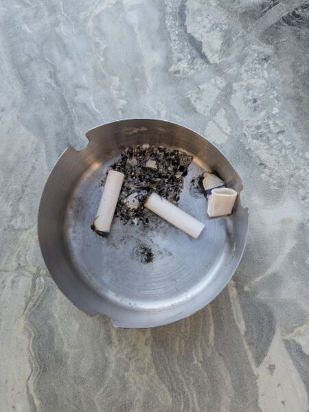File:Cigarette butts in ashtray.jpg